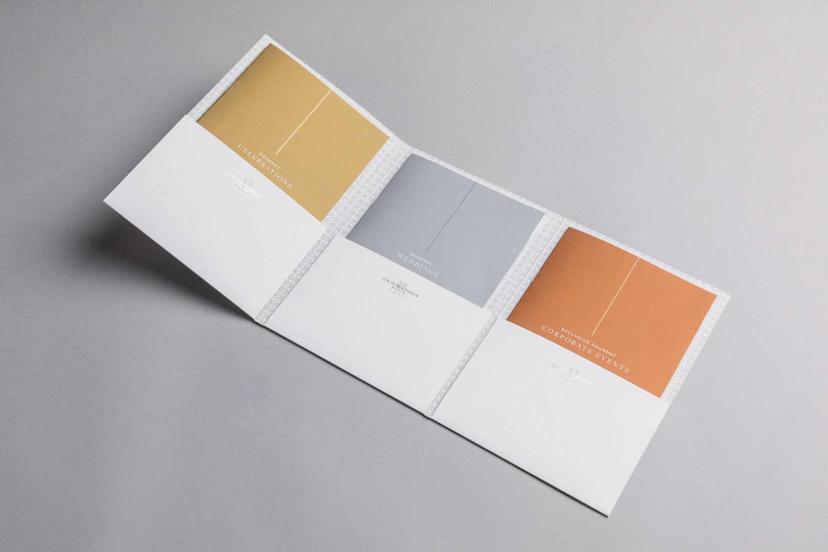 Color swatches in gold, gray, and copper on a white tri-fold brochure.