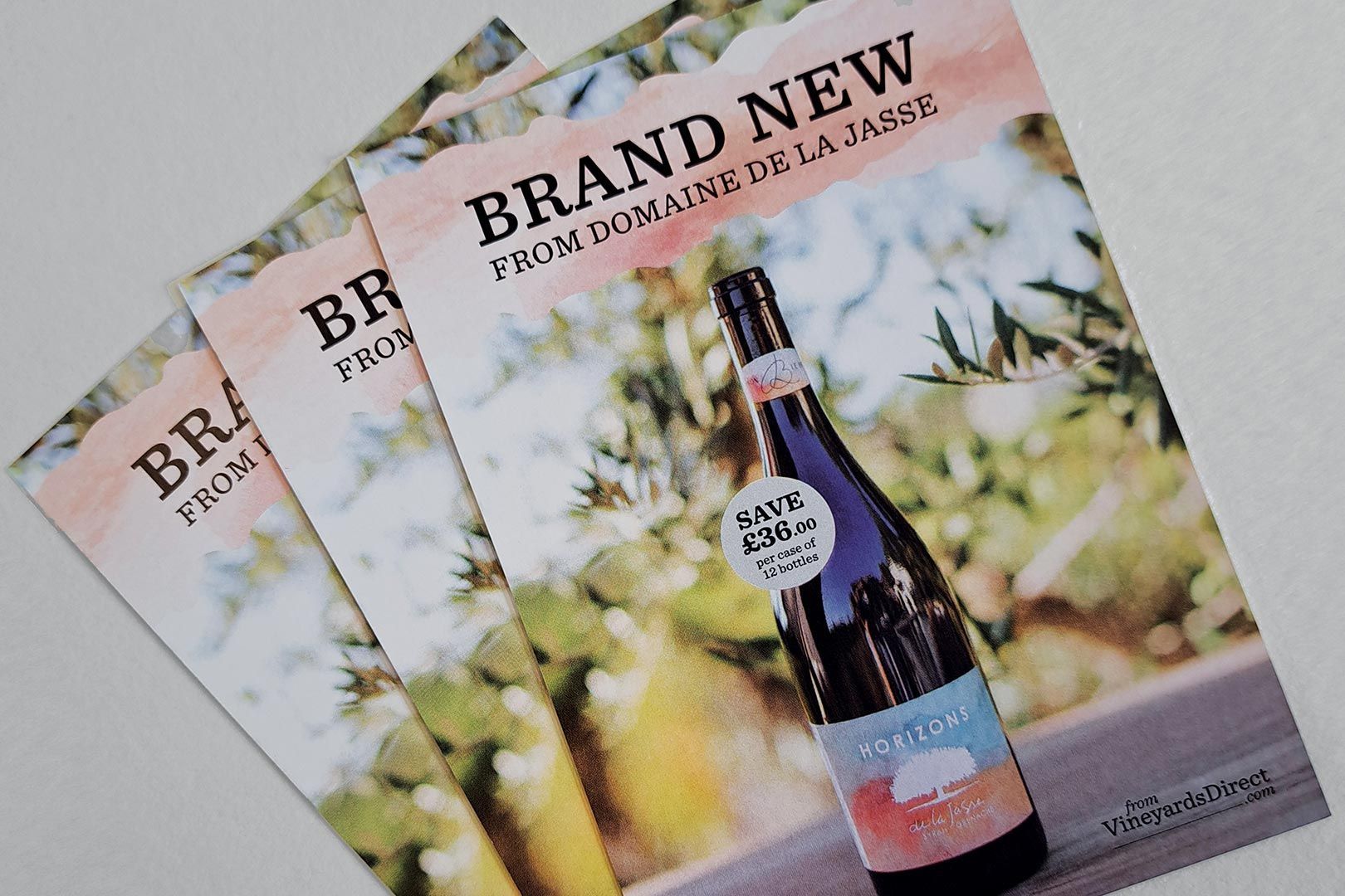 Three flyers with a wine bottle on them, text reads 