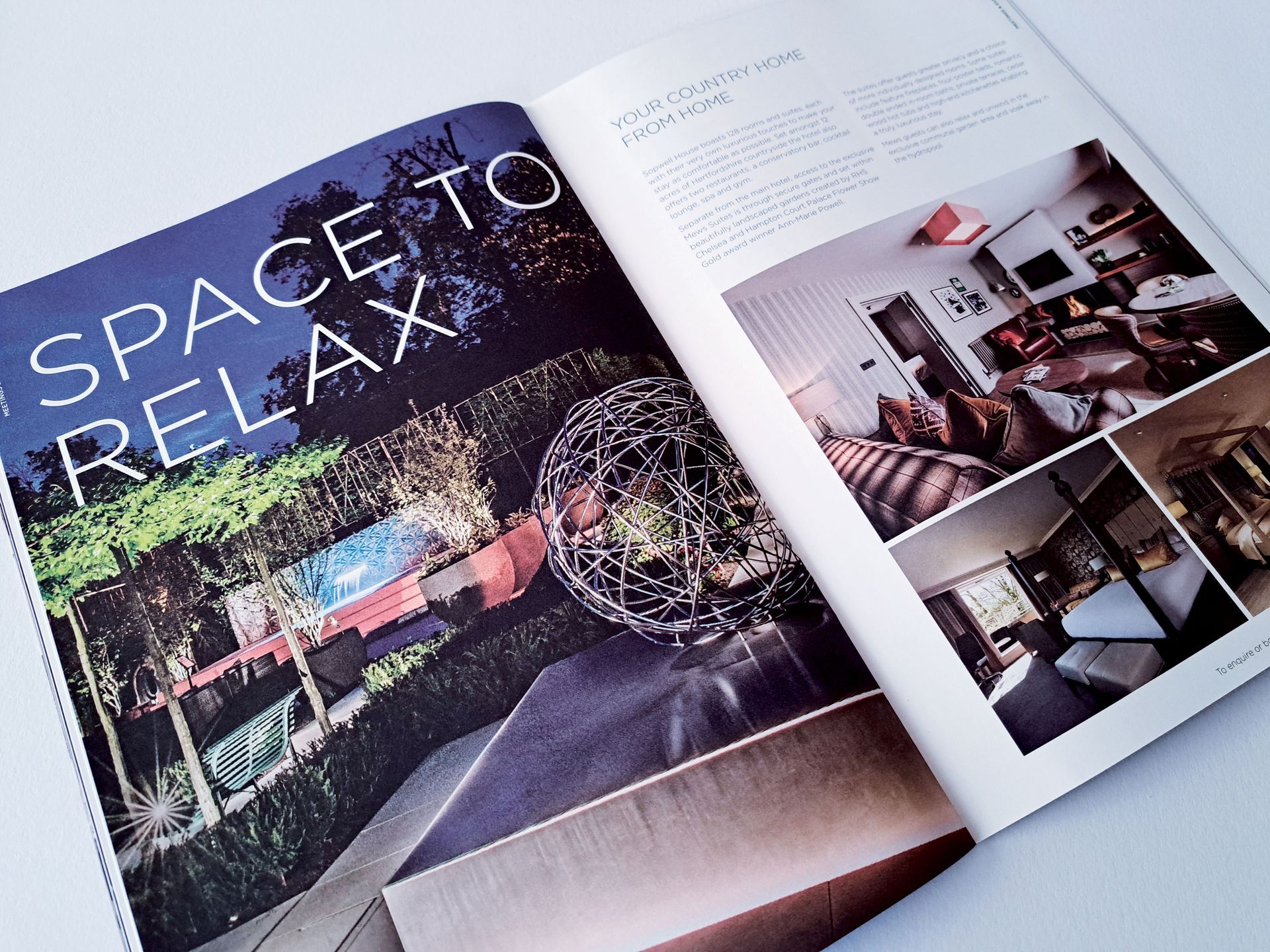 Open magazine spread with the title