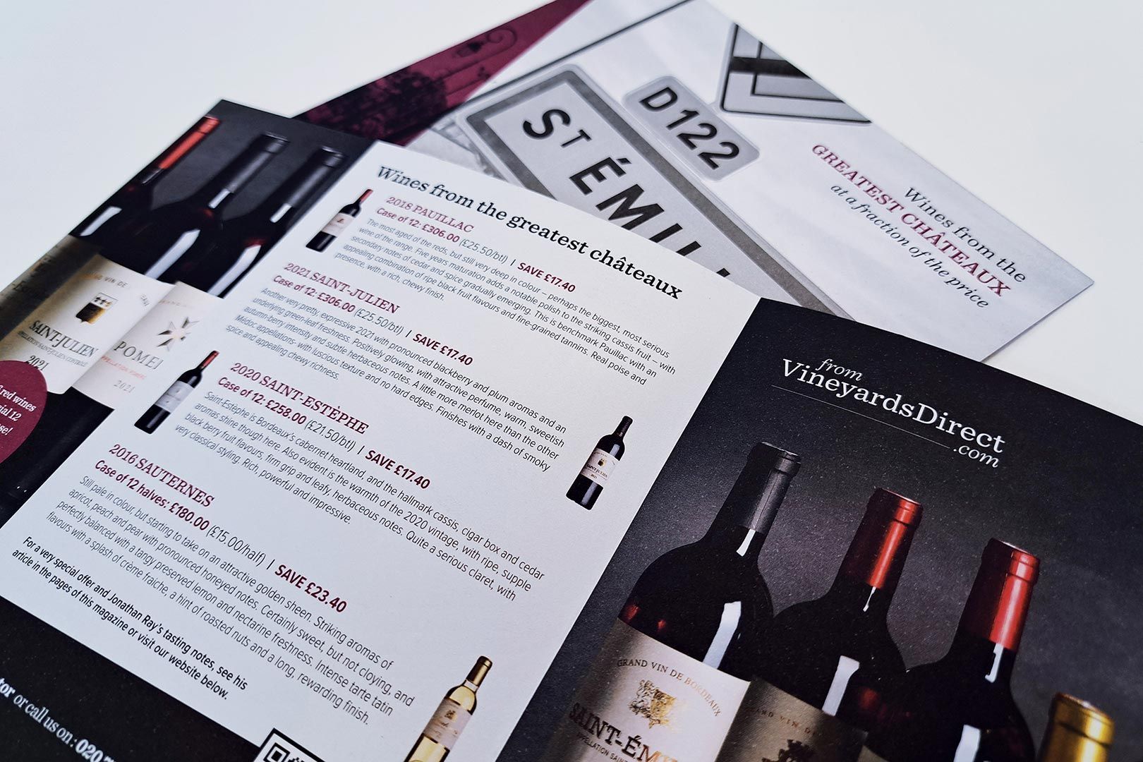 Brochures showcasing wine bottles and text, featuring 