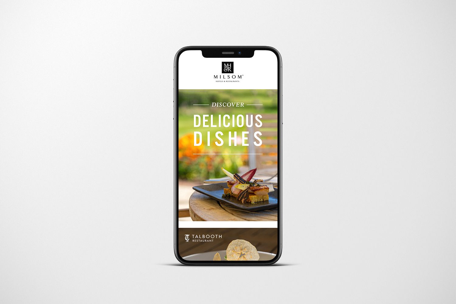Phone displaying Talboth House & Spa ad: