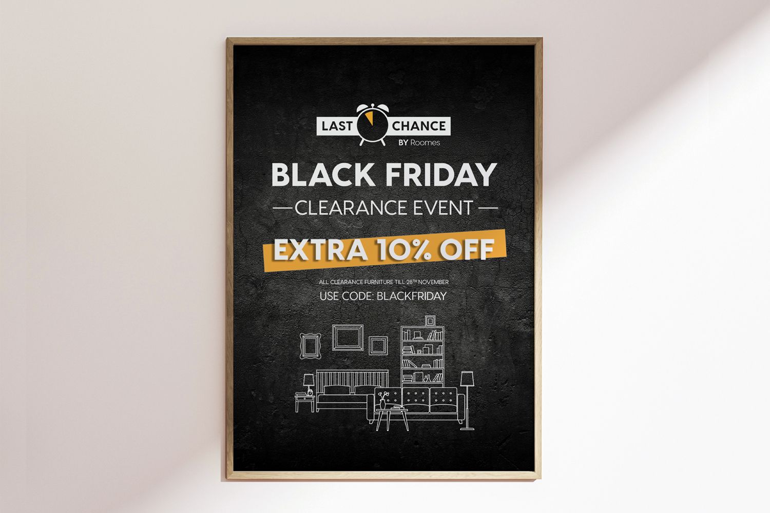 Black Friday sale poster on a wall with 10% off; black background with white text and gold accents.