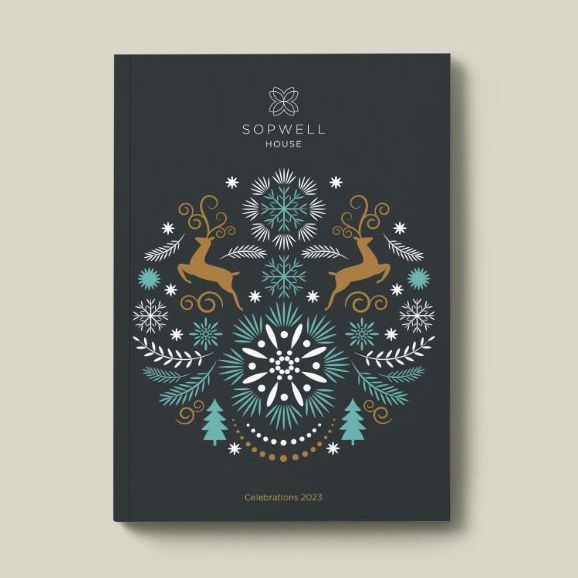 Dark blue book cover with a decorative winter design, reindeer, snowflakes, and Sopwell House logo.
