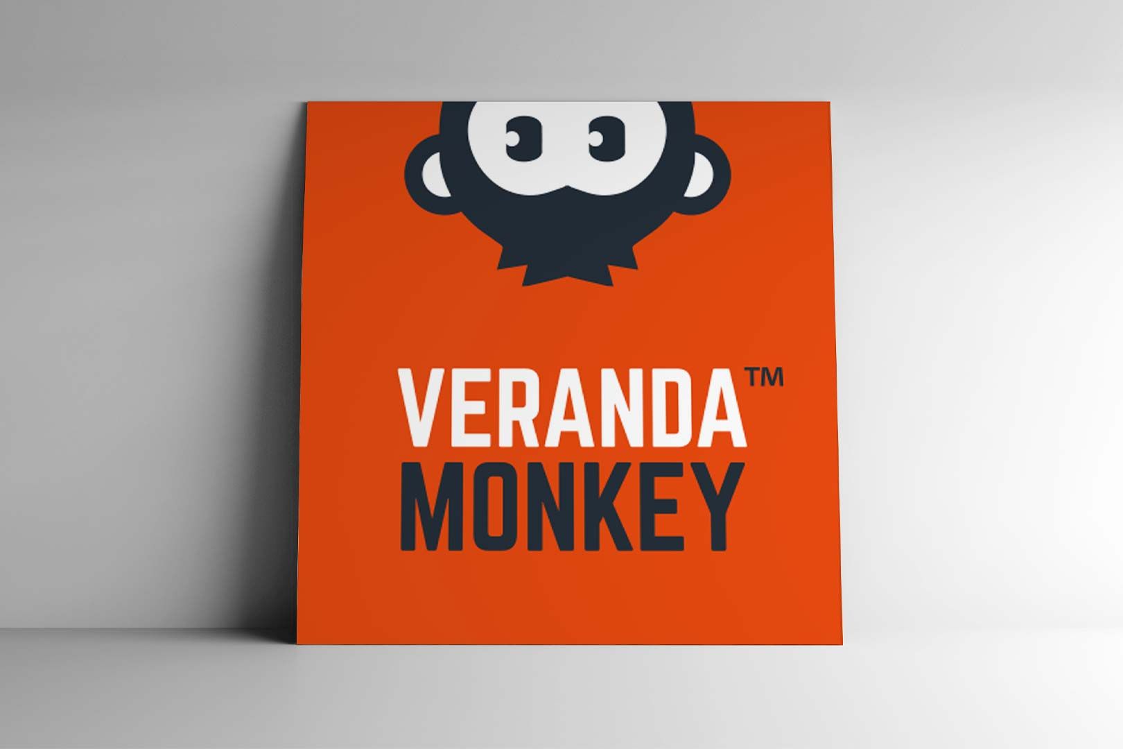 Orange square with dark blue monkey graphic above white text: