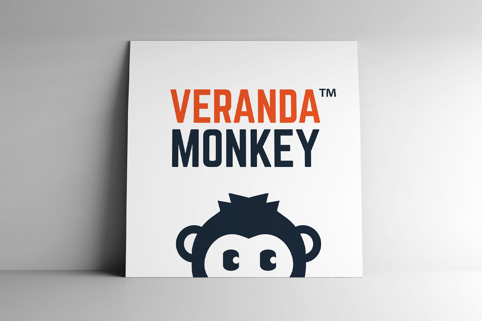 Logo for Veranda Monkey: orange text above dark blue 