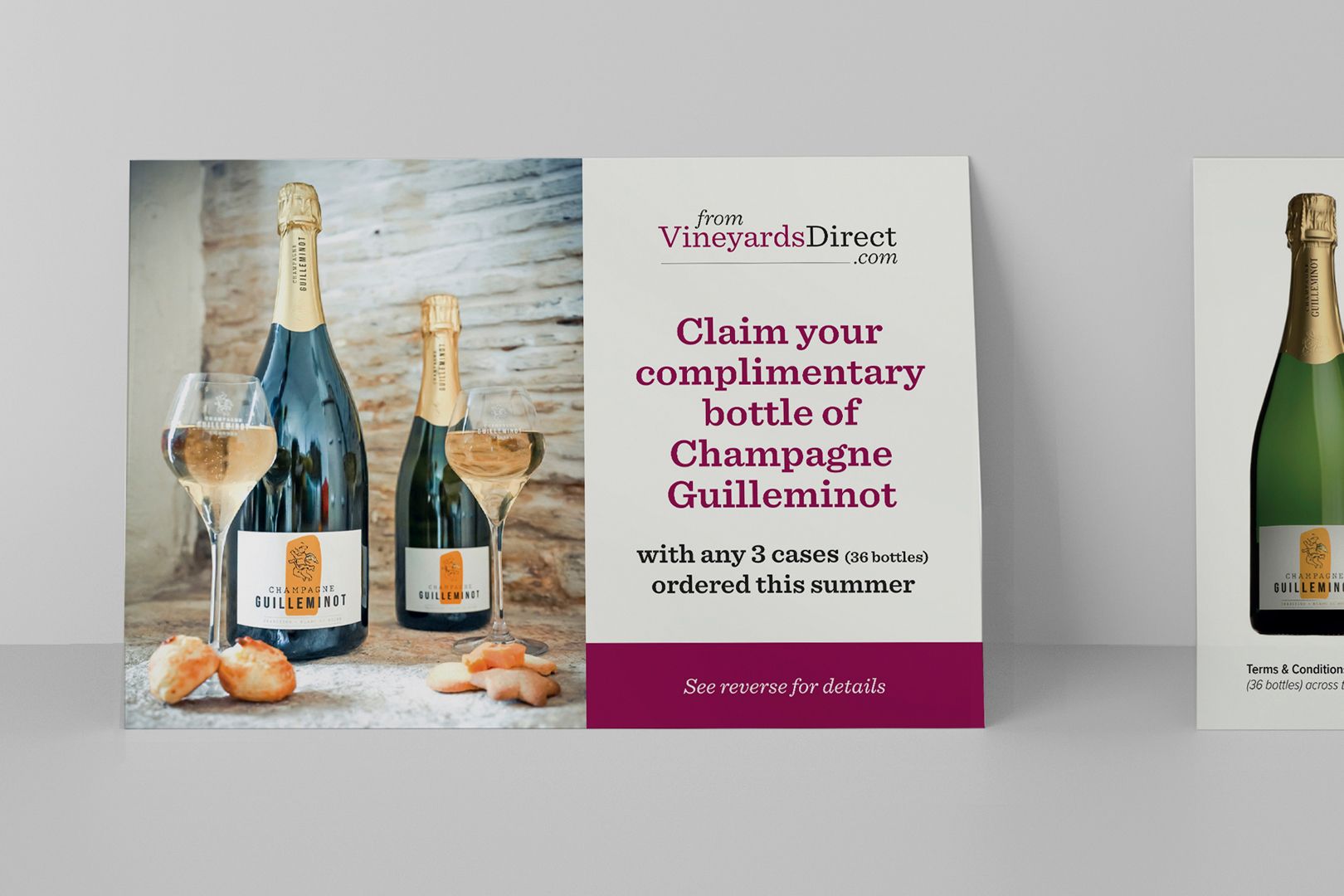 Champagne bottles with glasses and a promotional sign: 