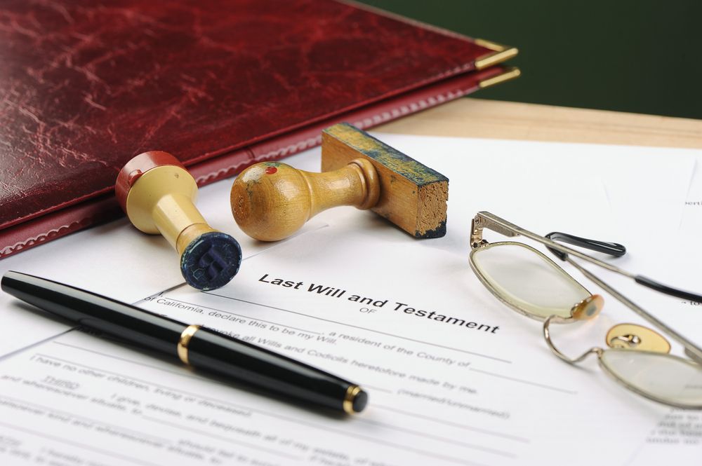 A Pen And Glasses Are On Top Of A Will — Clarence Valley Legal In Grafton, NSW