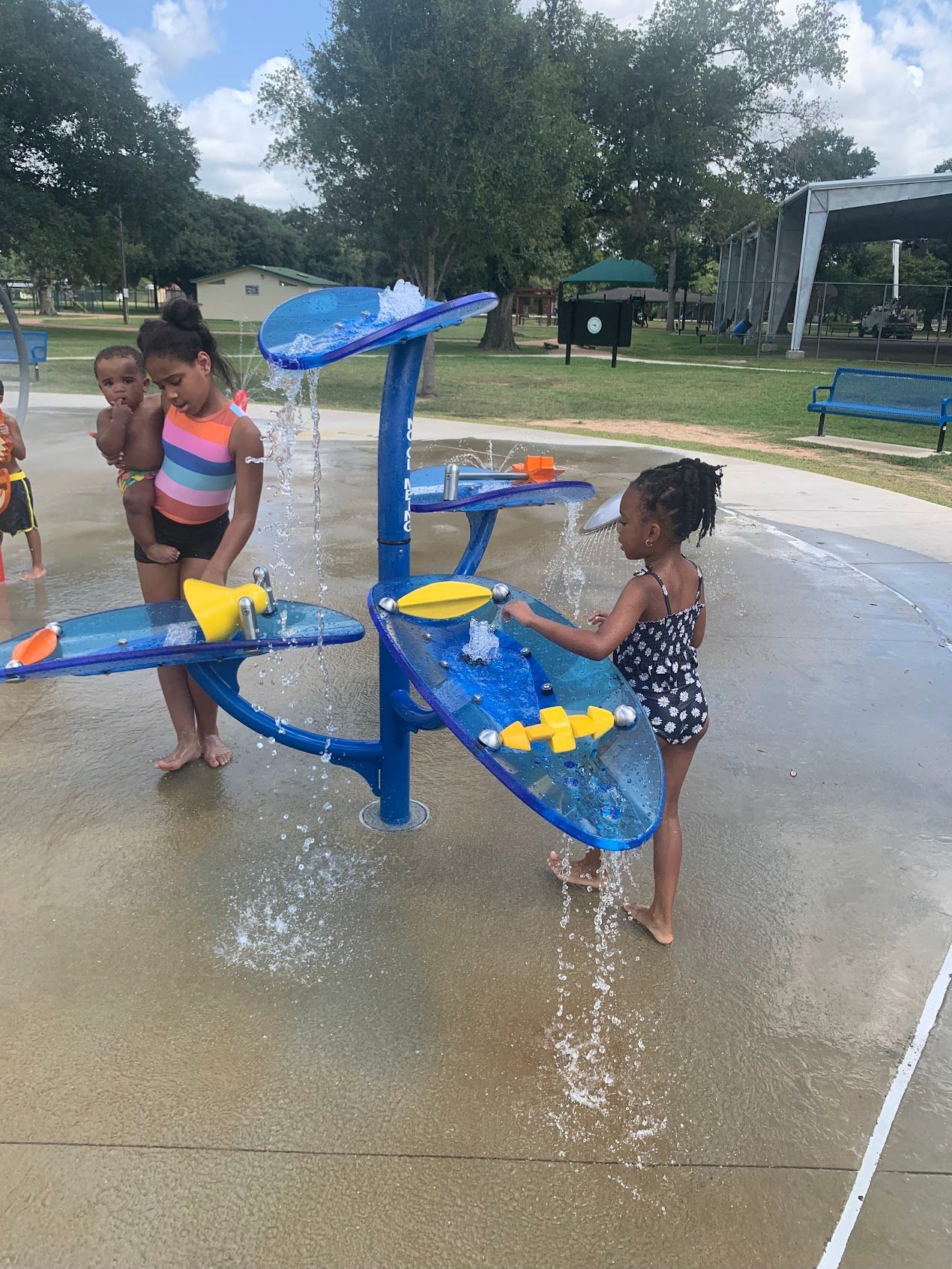 A group of children are playing in a water park.