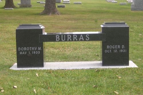 A black granite bench-style headstone with the name 