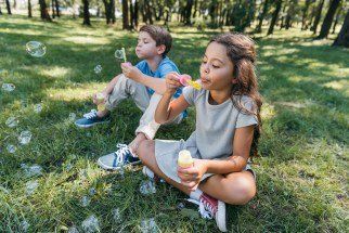 Kids blowing bubbles — S. Miami, FL — Sutton Law Group