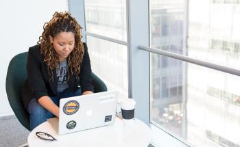 Woman with her laptop — S. Miami, FL — Sutton Law Group
