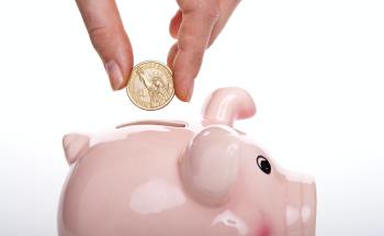 Putting coin into the piggybank — S. Miami, FL — Sutton Law Group