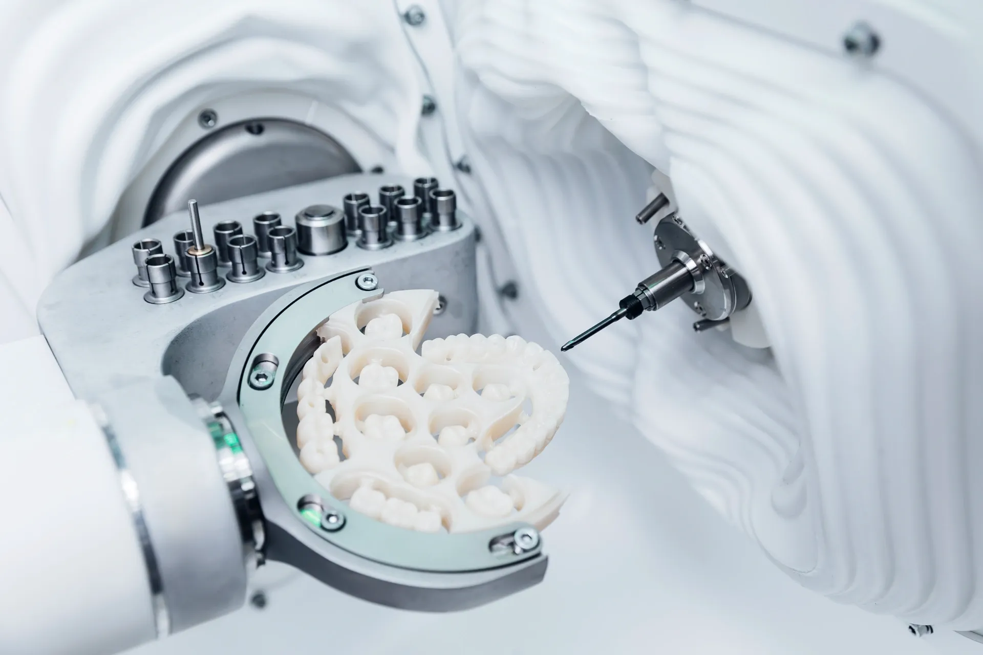 Dental Milling Machine Shaping a Ceramic Tooth Restoration — AB Esthetic Dental Laboratory in Sunshine Coast, QLD