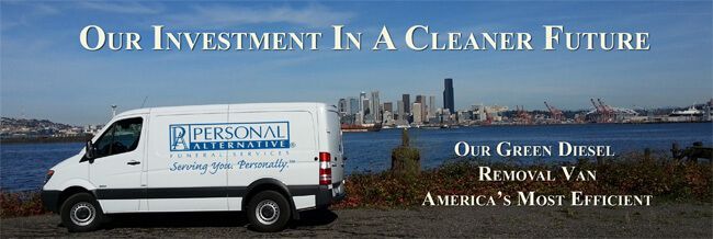 White service van on a waterfront road with slogan about a cleaner future and organic diesel against a city skyline