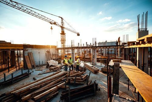 A Group Of Construction Workers Are Standing In A Construction Site - Millville, CA - Concrete Construction Excavating Inc. A Group Of Construction Workers Are Standing In A Construction Site - Millville, CA - Concrete Construction Excavating Inc.
