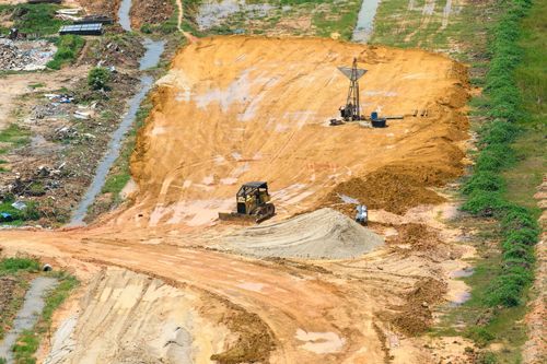 An Aerial View Of A Construction Site With A Bulldozer And A Crane - Millville, CA - Concrete Construction Excavating Inc.