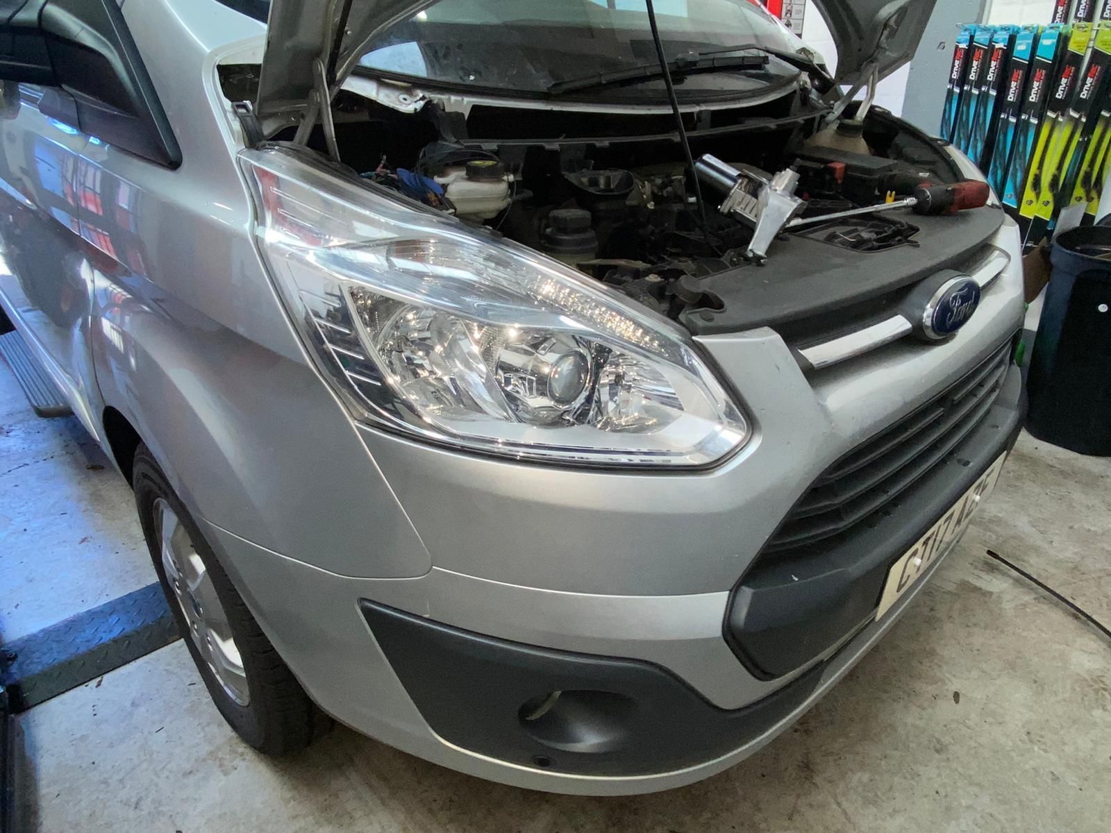 Mobile Mechanic Reading wiper motor wire repair on Ford Transit Van