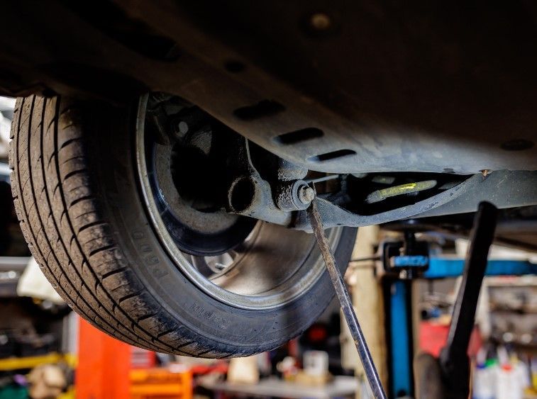 about to check under car as part of Mobile Mechanic Reading's car MOT service for a Caversham customer