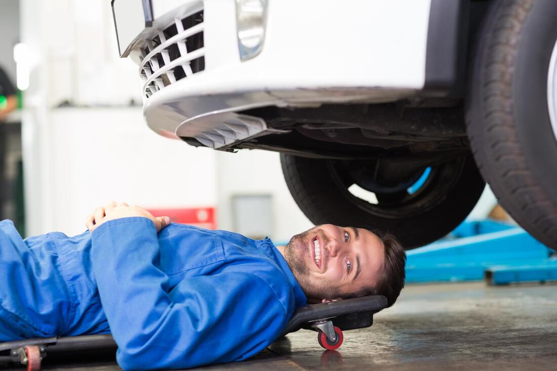 about to check under car as part of Mobile Mechanic Tilehurst car MOT service