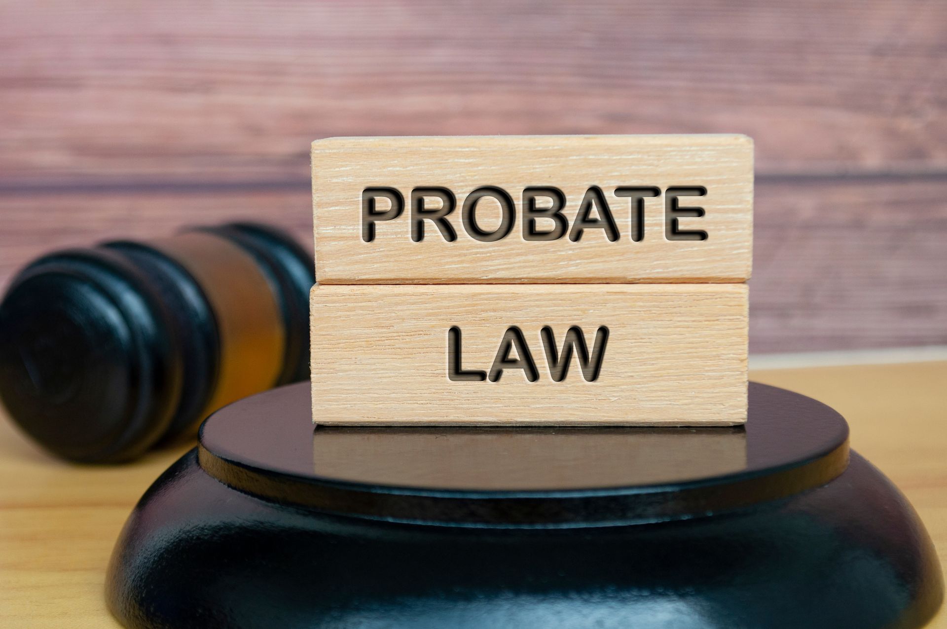 Probate law engraved on wood with gavel background. Probate law engraved on wood with gavel background.