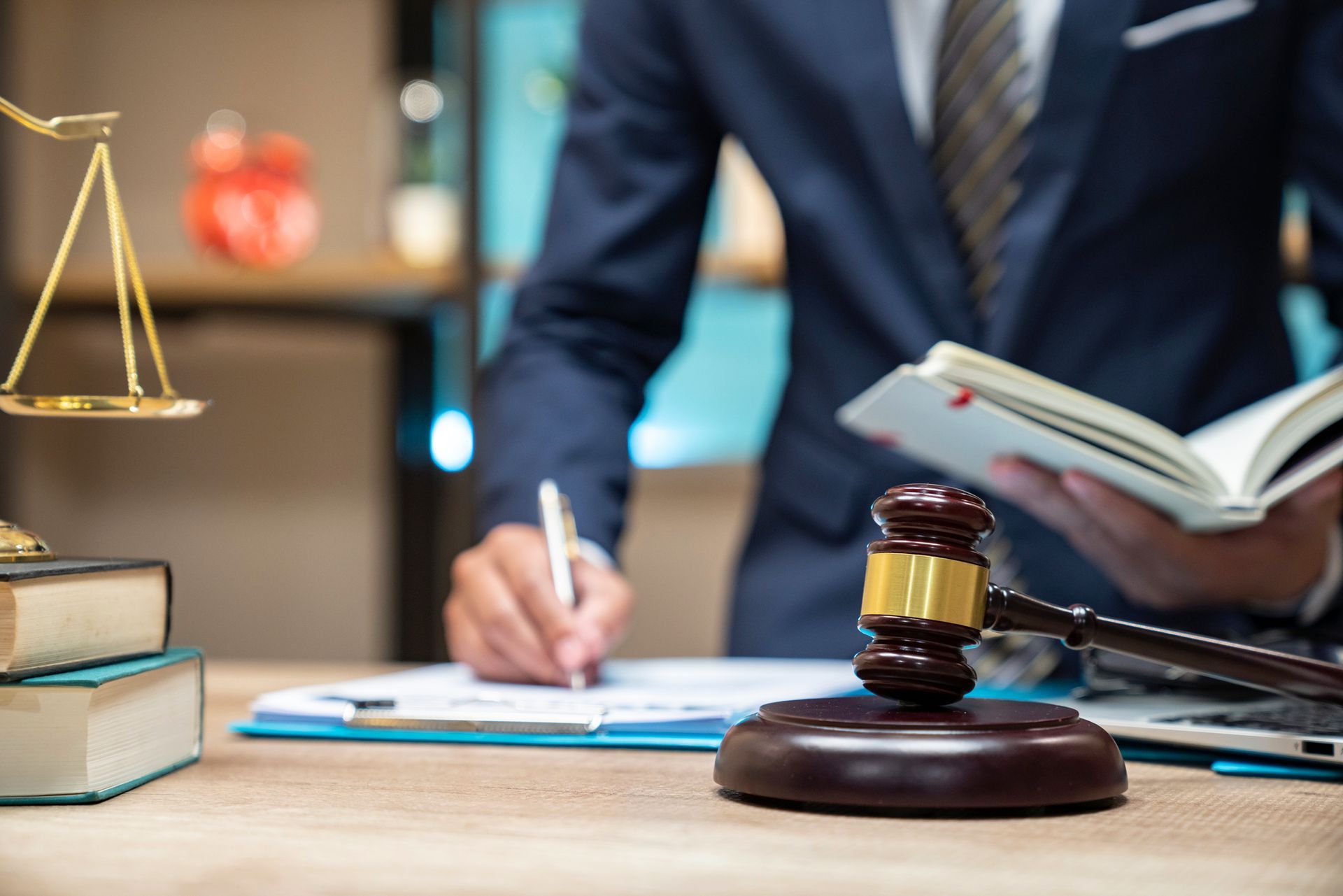 Close up lawyer businessman working or reading lawbook in office workplace for consultant.