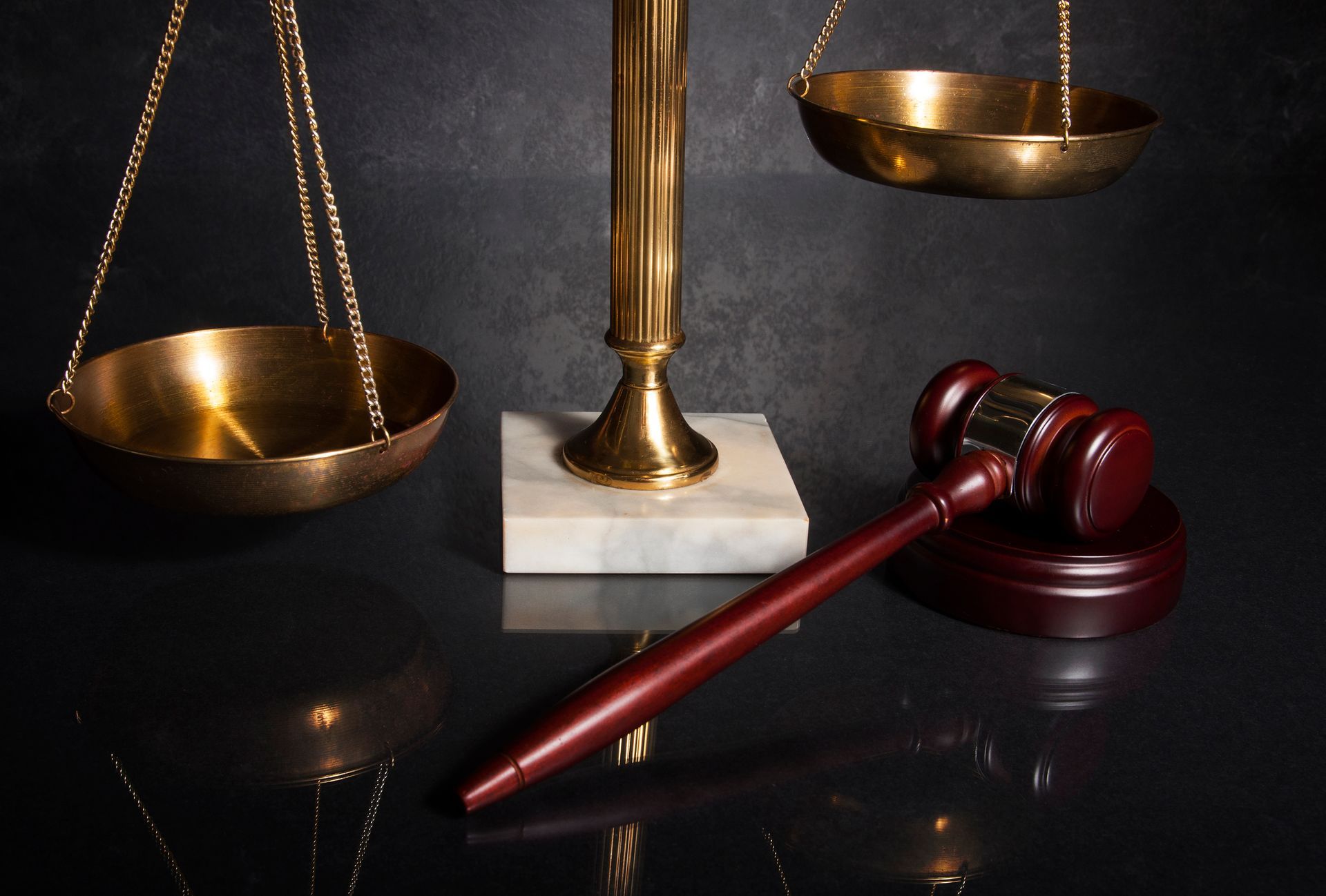 Golden balance scales and wooden gavel representing fairness in Probate Law Services.