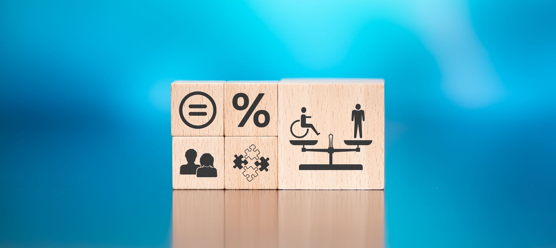 A set of dice display the concept of social equality for people of all abilities.