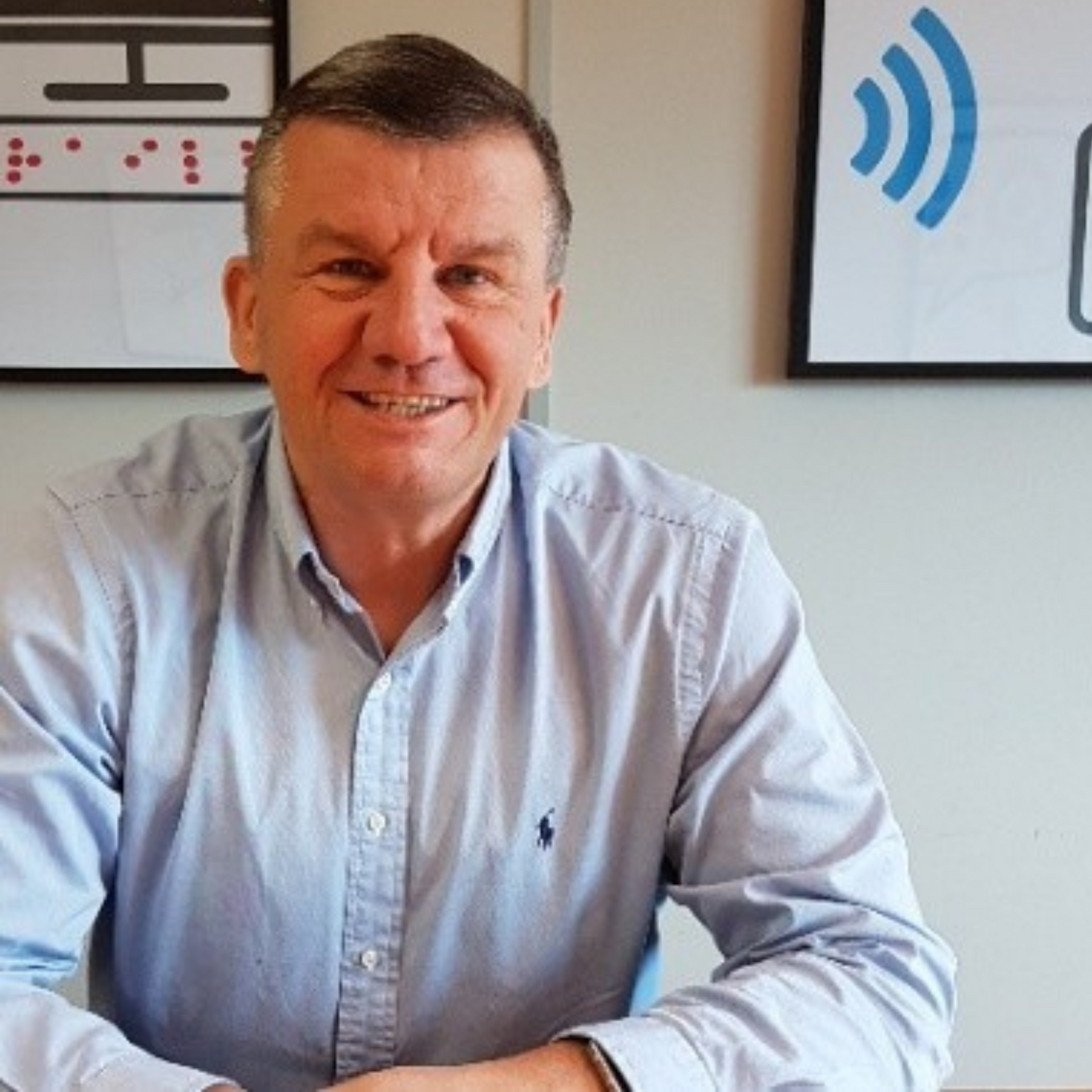 Steve Bennett from Dolphin Computer Access | Easy Reader smiling in his office.