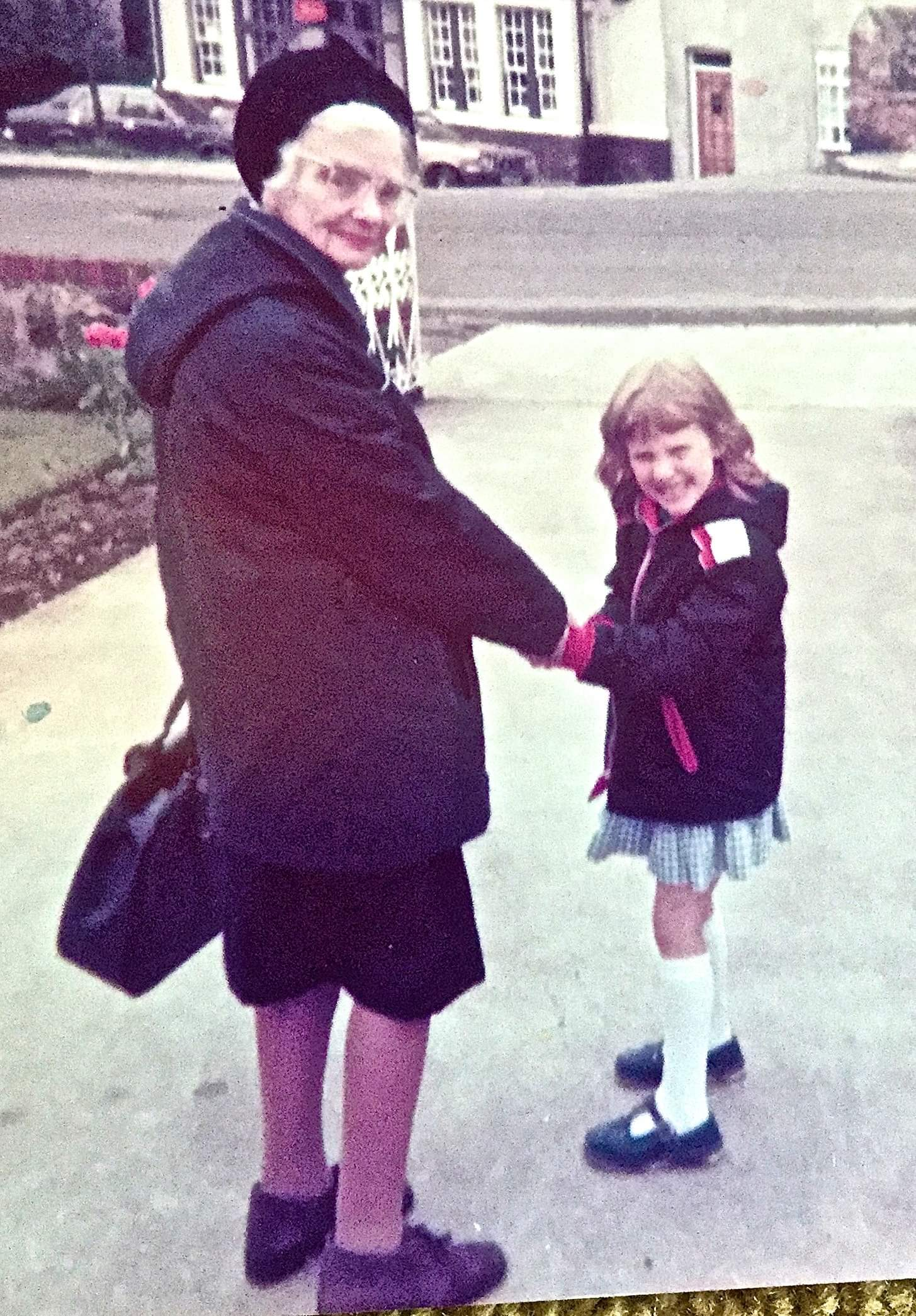 Bec, aged 5, holding hands with Ivy