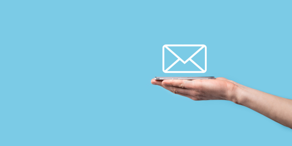 Hand holding an envelope icon, blue background.