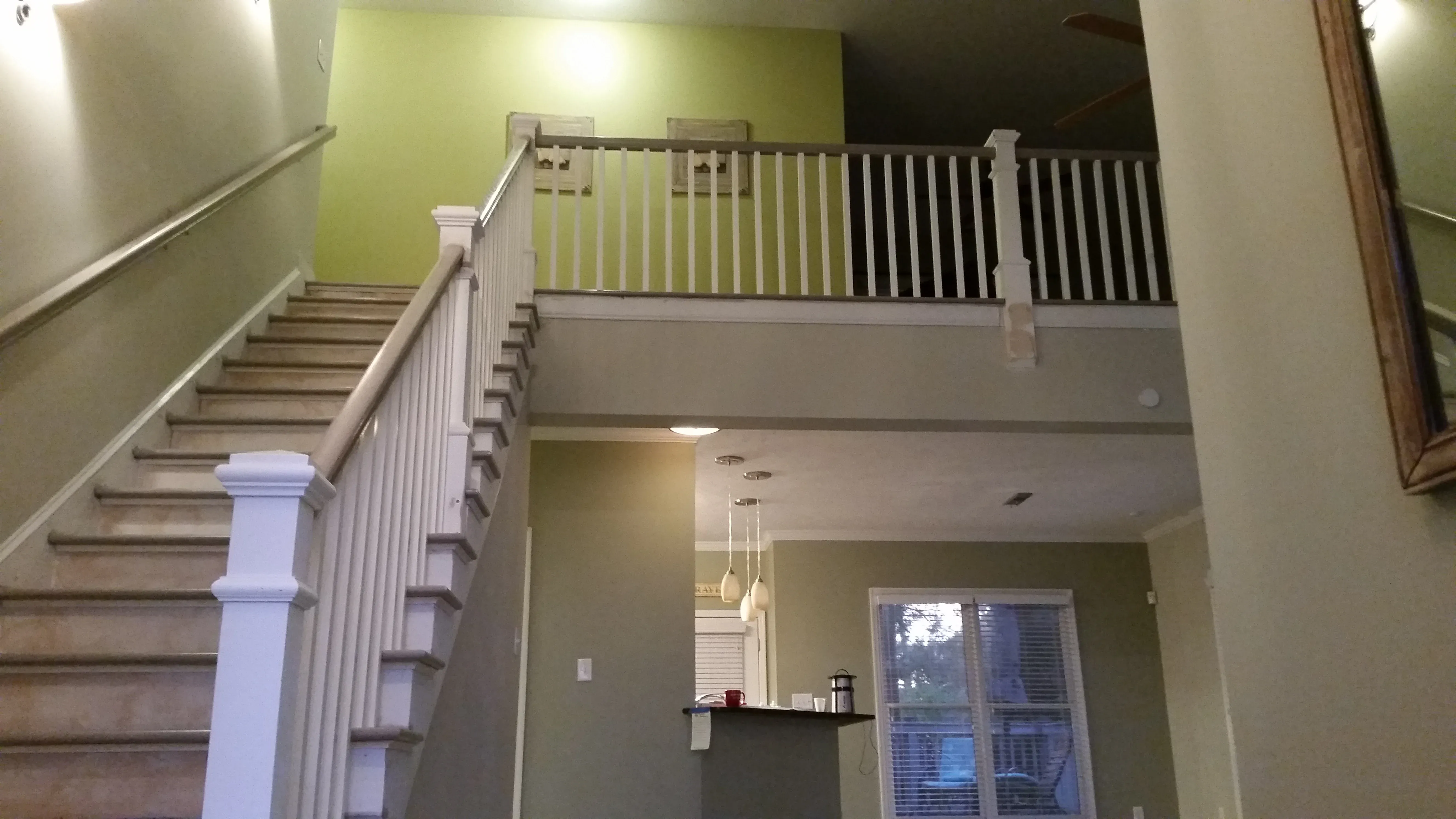 A staircase leading up to the second floor of a house