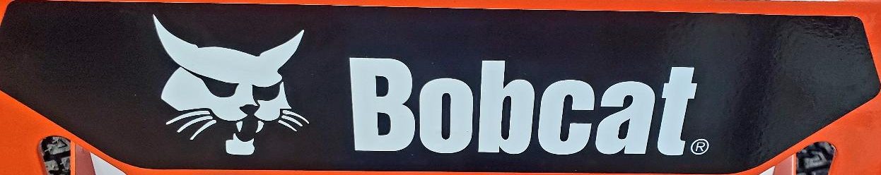 A bobcat logo is on the side of an orange vehicle.
