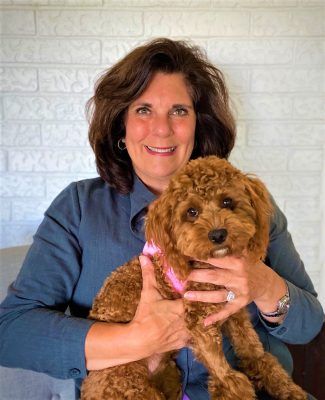 Woman Holding A Dog