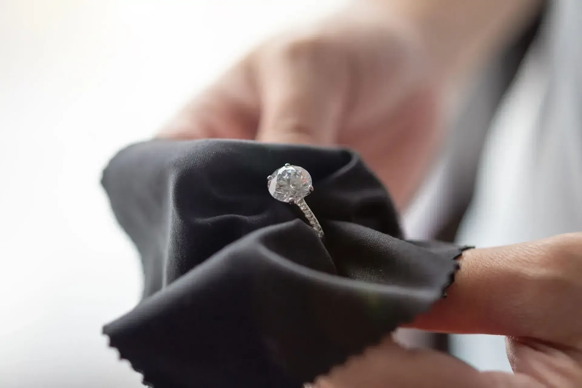 Jeweller Cleaning Diamond Ring