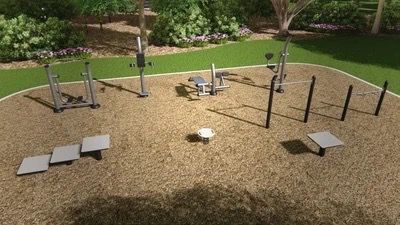 Outdoor fitness trail with exercise equipment in a park