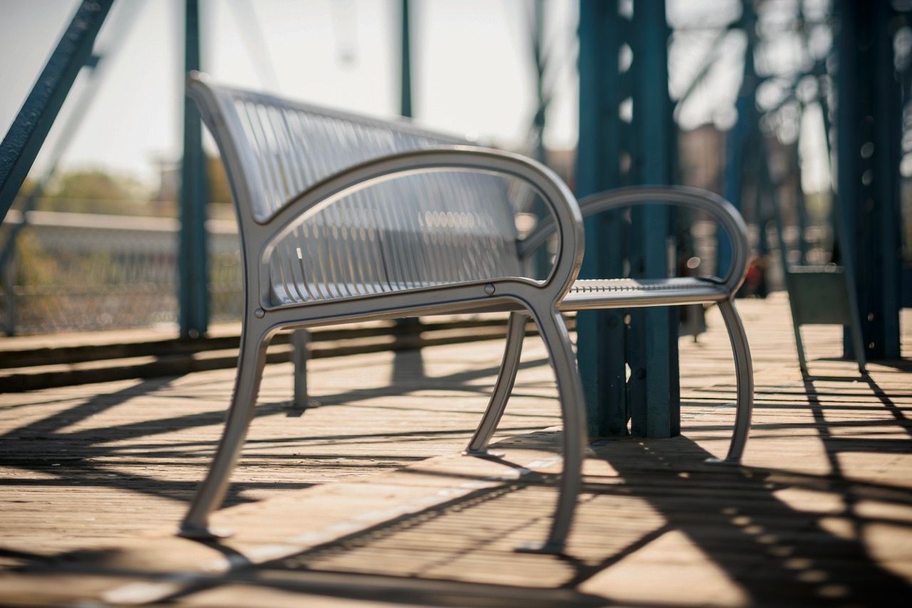Park benches and site furnishings around a playground
