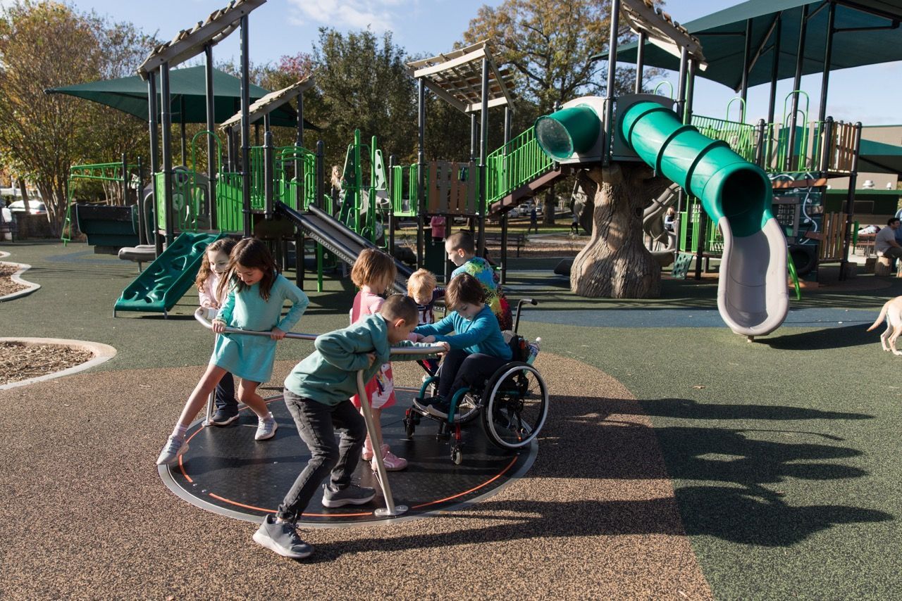 Safety surfacing beneath a playground