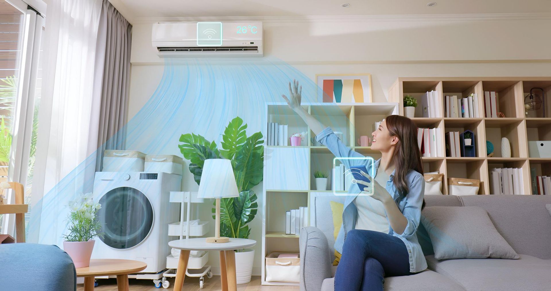 Woman adjusts air conditioner settings on a tablet in a well-lit living room.