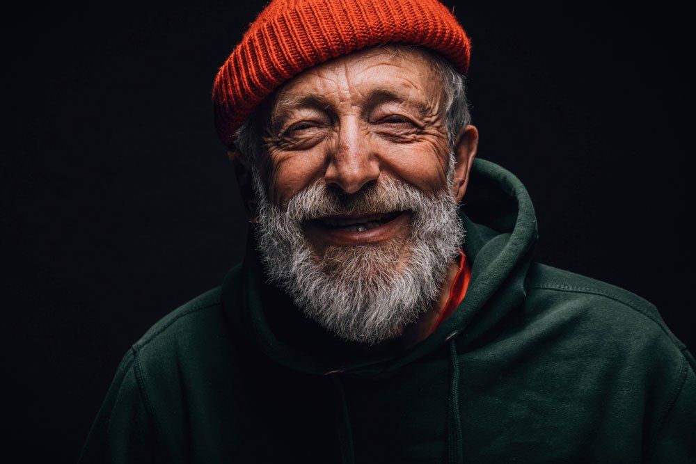 Homeless man smiling