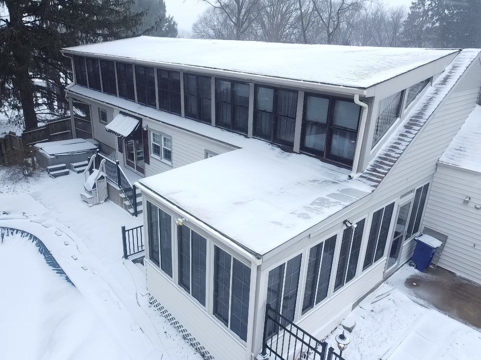 Home with a gutter installation By Erie Roofing Pros
