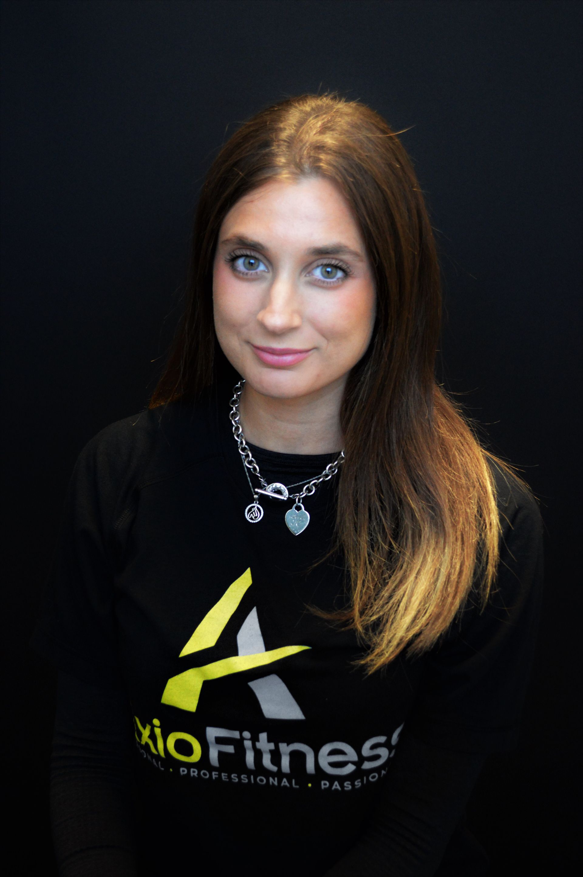 Woman with long brown hair wearing a black 