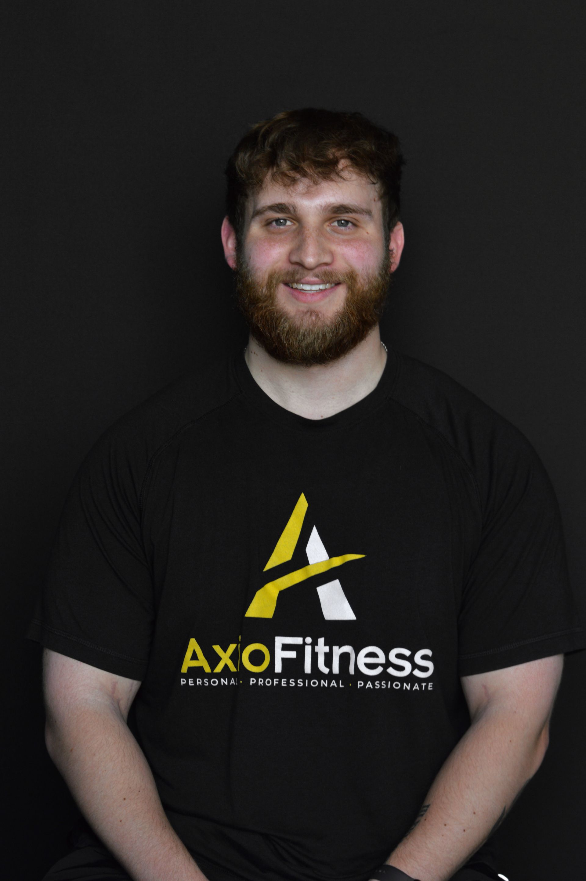 A man with a beard wearing a black