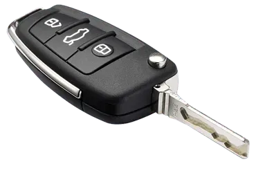 A close up of a car key on a white background