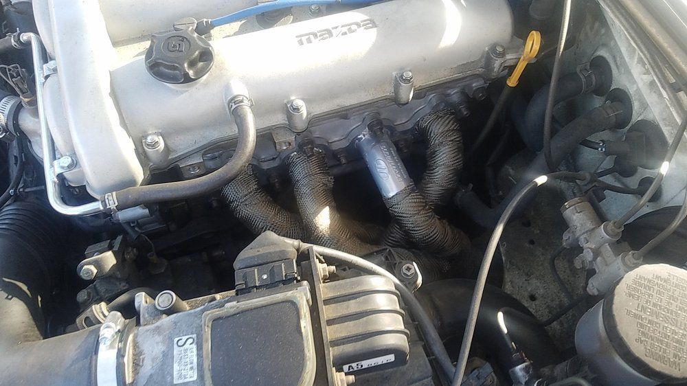 A close up of the engine of a car.