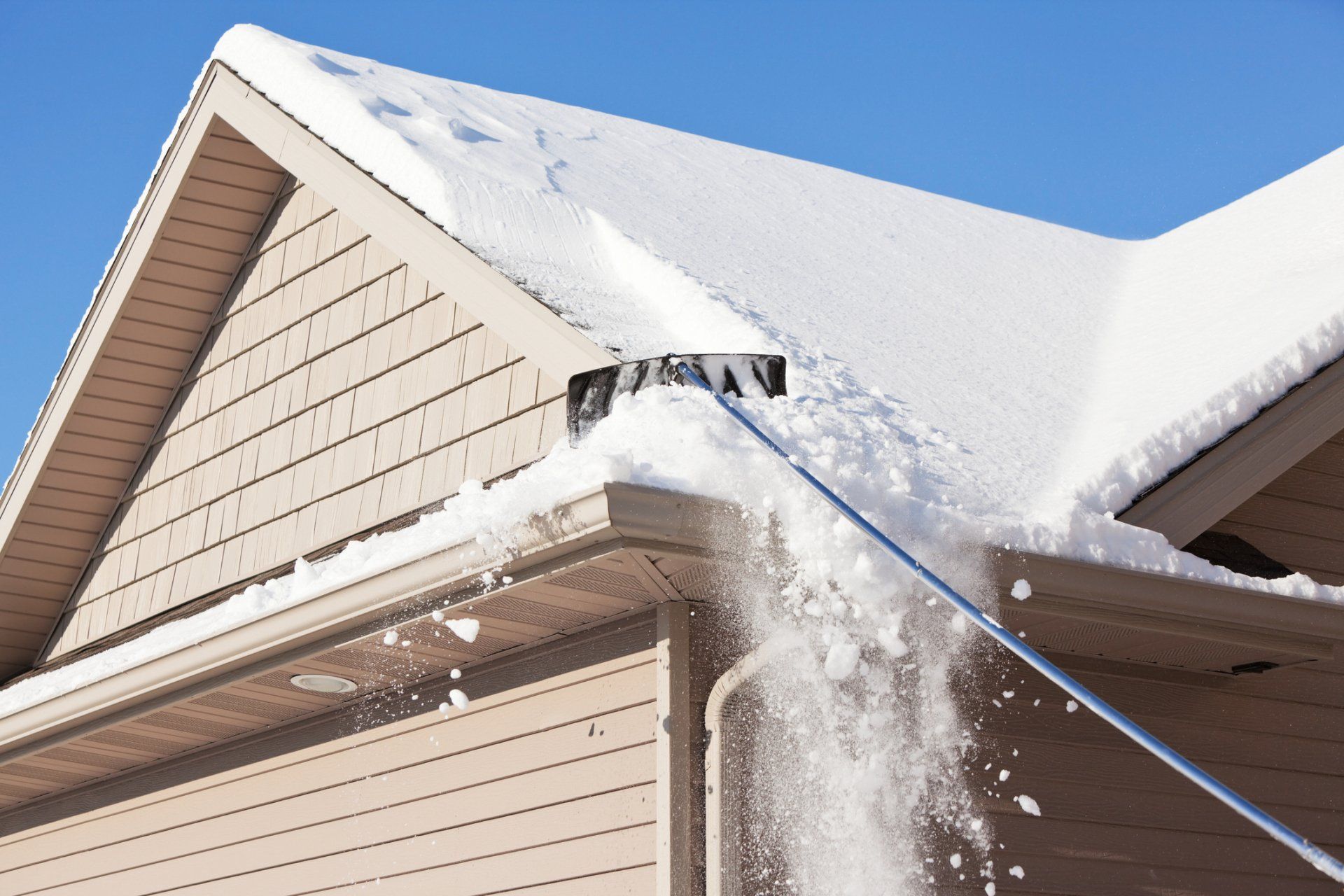 Removing snow — Minneapolis, MN— John Haley #1 Roofer