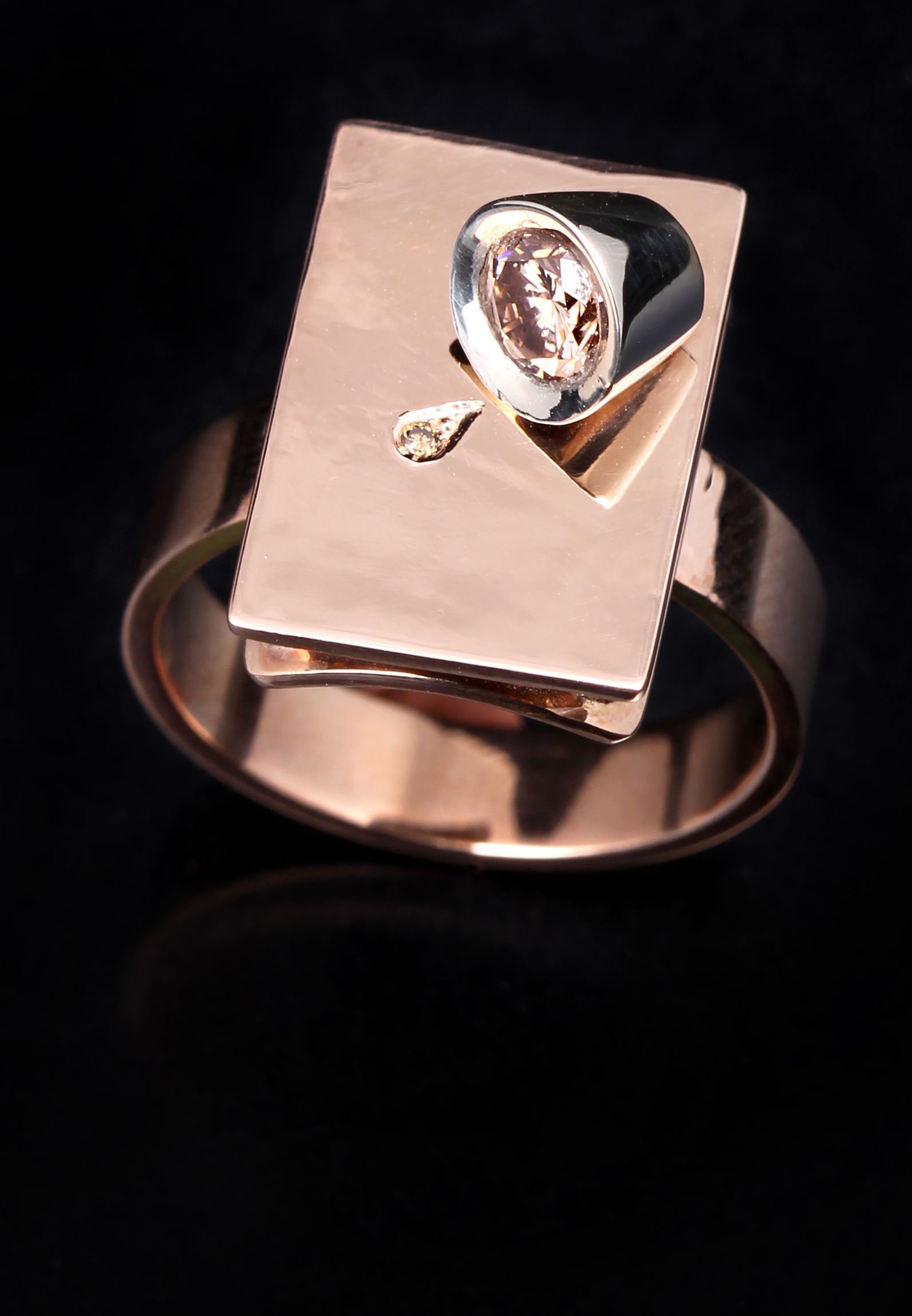 A gold ring with a diamond in the center