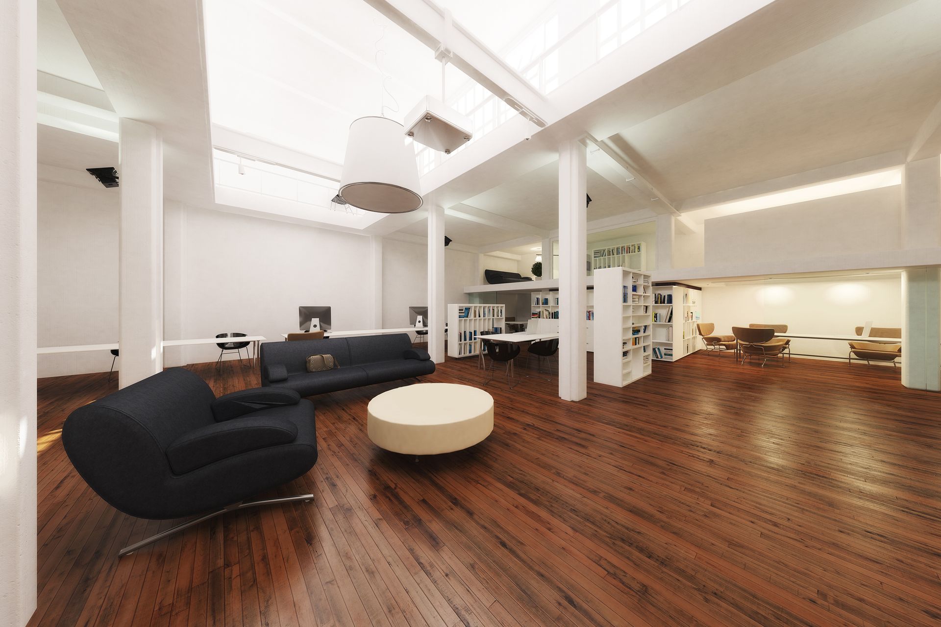 Spacious open-plan living area with hardwood floors, dark furniture, and white columns.