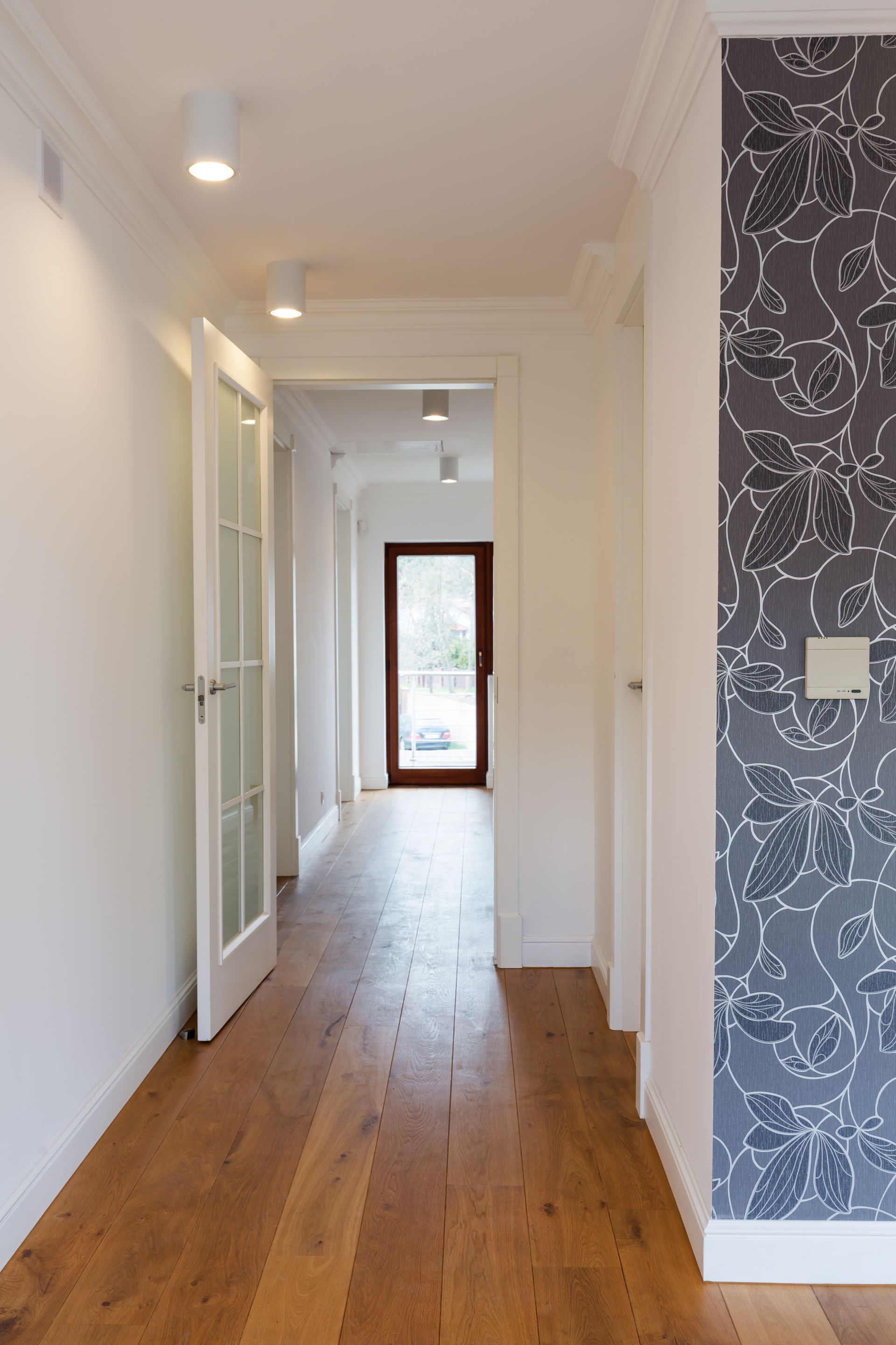 bright hallway with wooden flooring