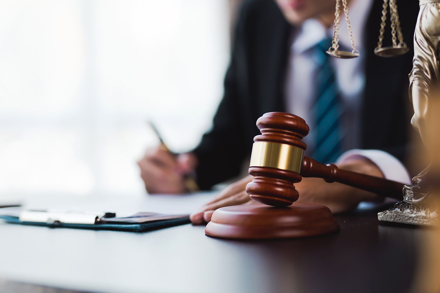 Close-up of a lawyer's desk with a gavel, symbolizing legal authority and bankruptcy law expertise. Close-up of a lawyer's desk with a gavel, symbolizing legal authority and bankruptcy law expertise.