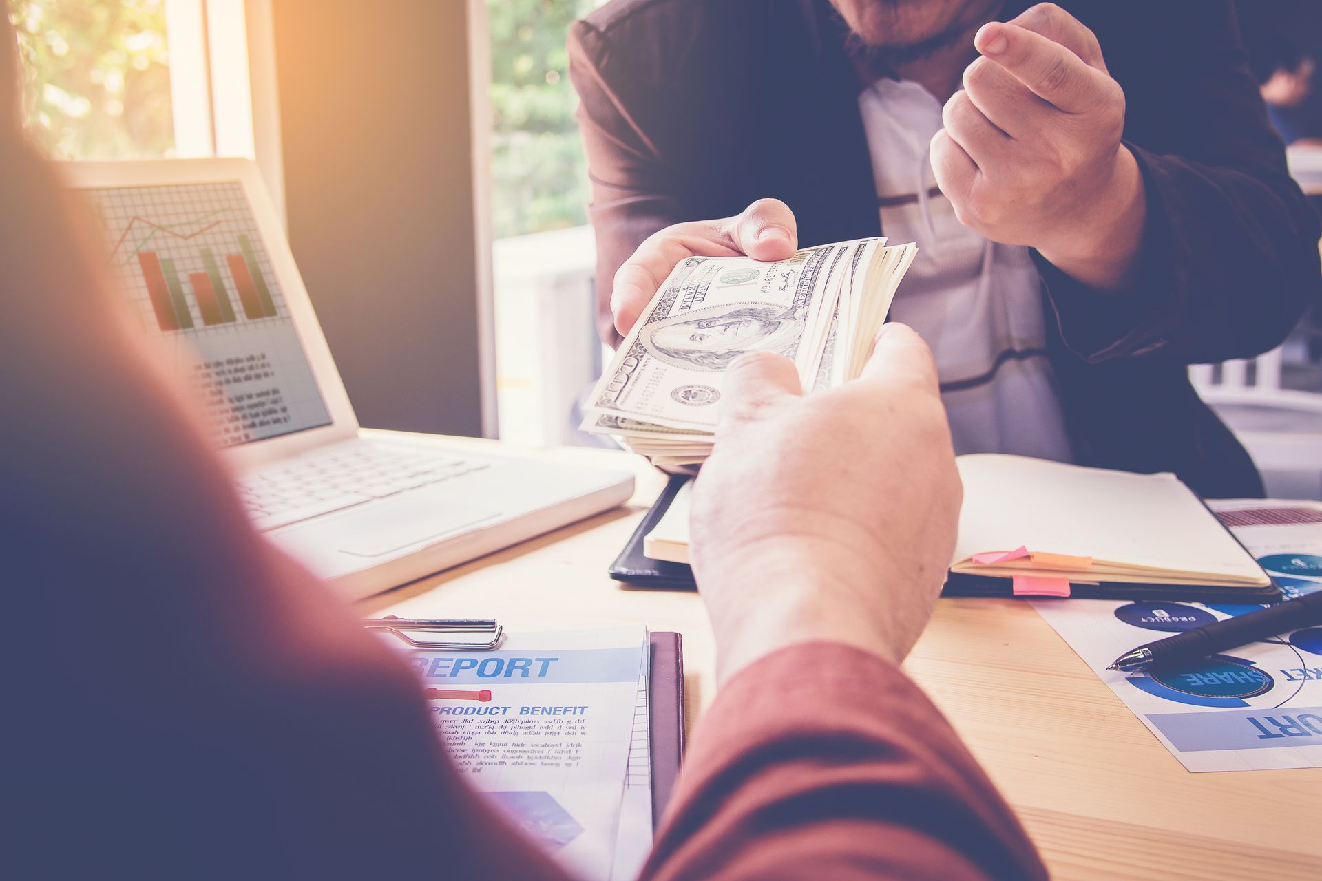 Two individuals exchanging money, showcasing instant cash loans for fast financial solutions. Two individuals exchanging money, showcasing instant cash loans for fast financial solutions.